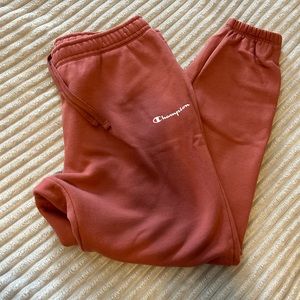 Women’s large Champion joggers. Dusty brick color. Drawstring and pockets.